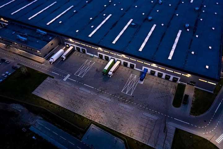 A distribution center glowing at dusk